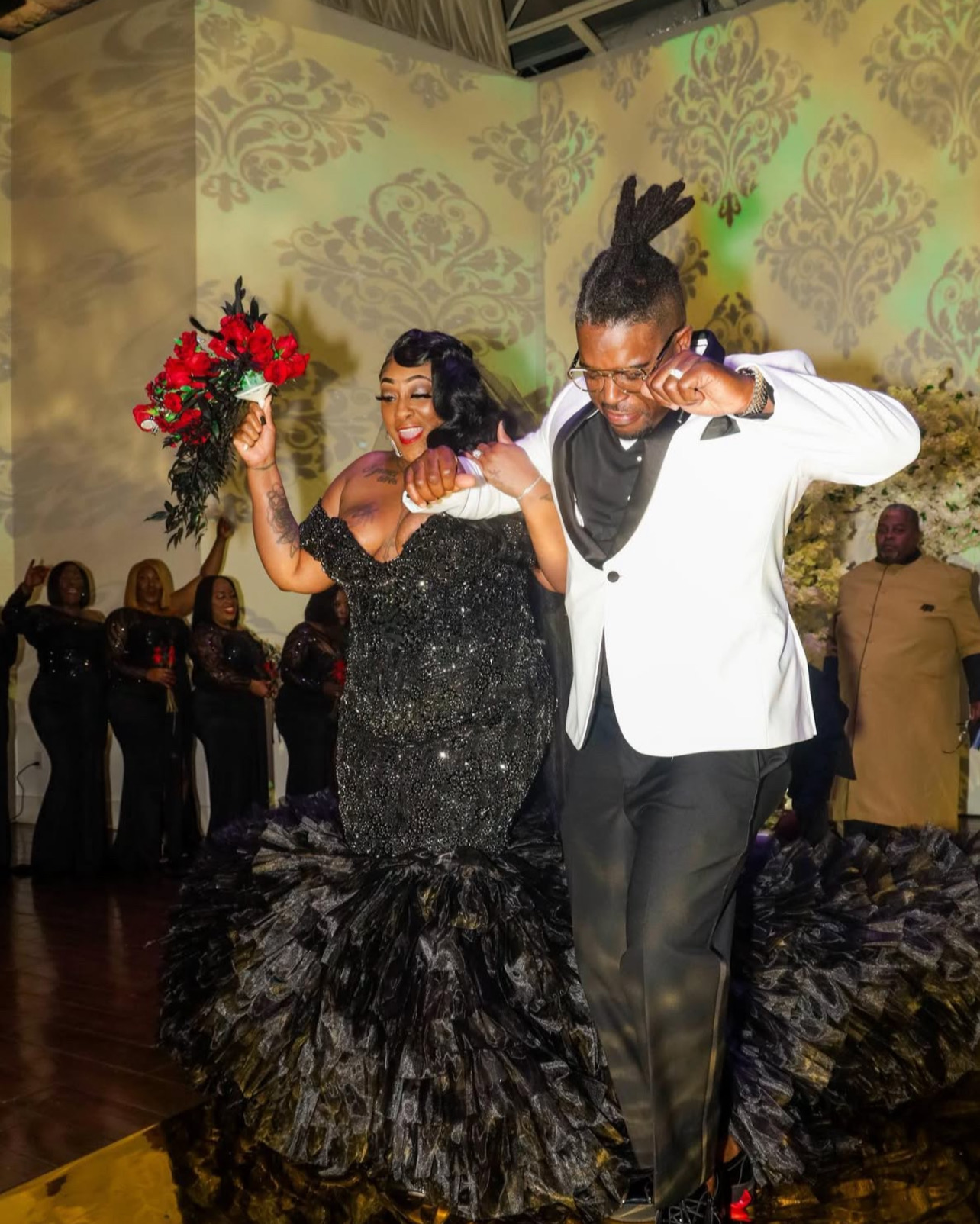 Two people dancing together at a formal celebration