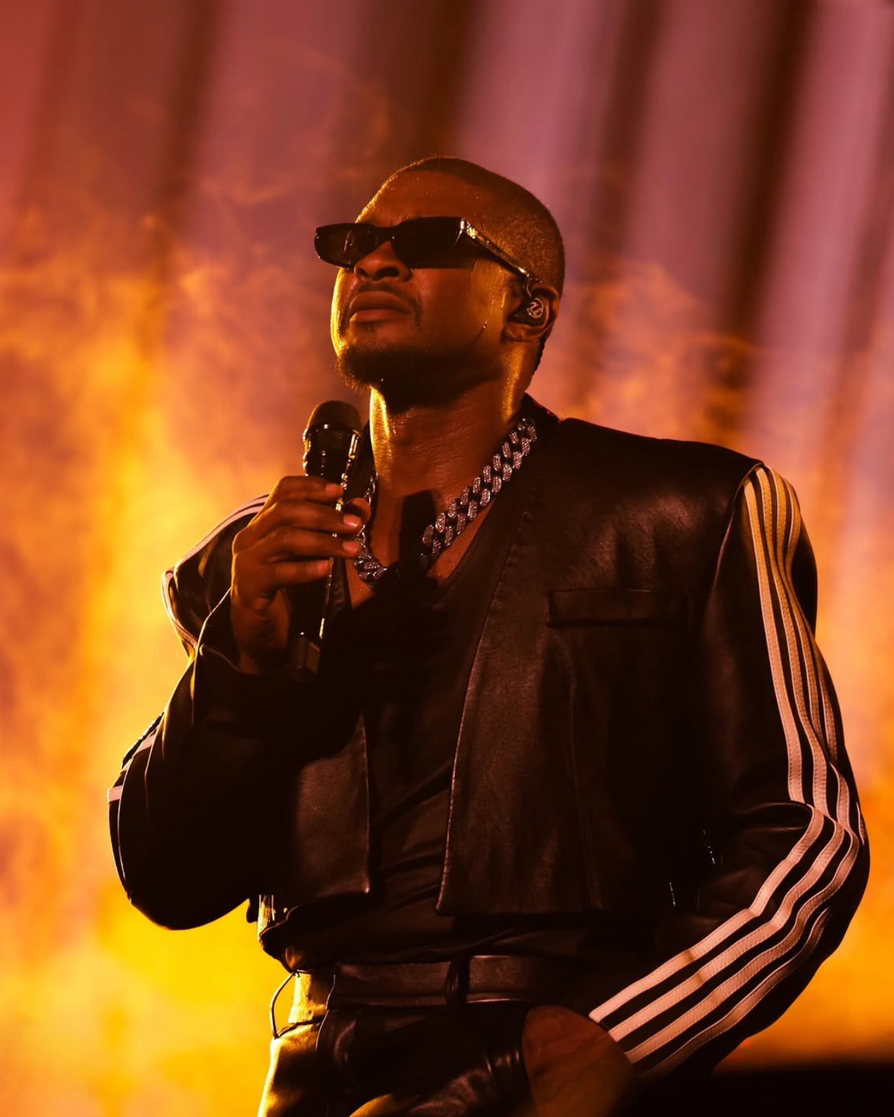 Artist performing on stage, photographed by DUKESHOTEM